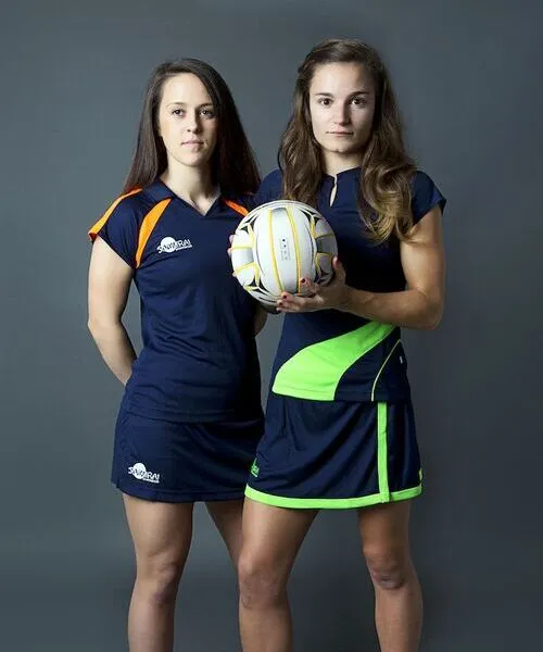 females wearing custom netball dress