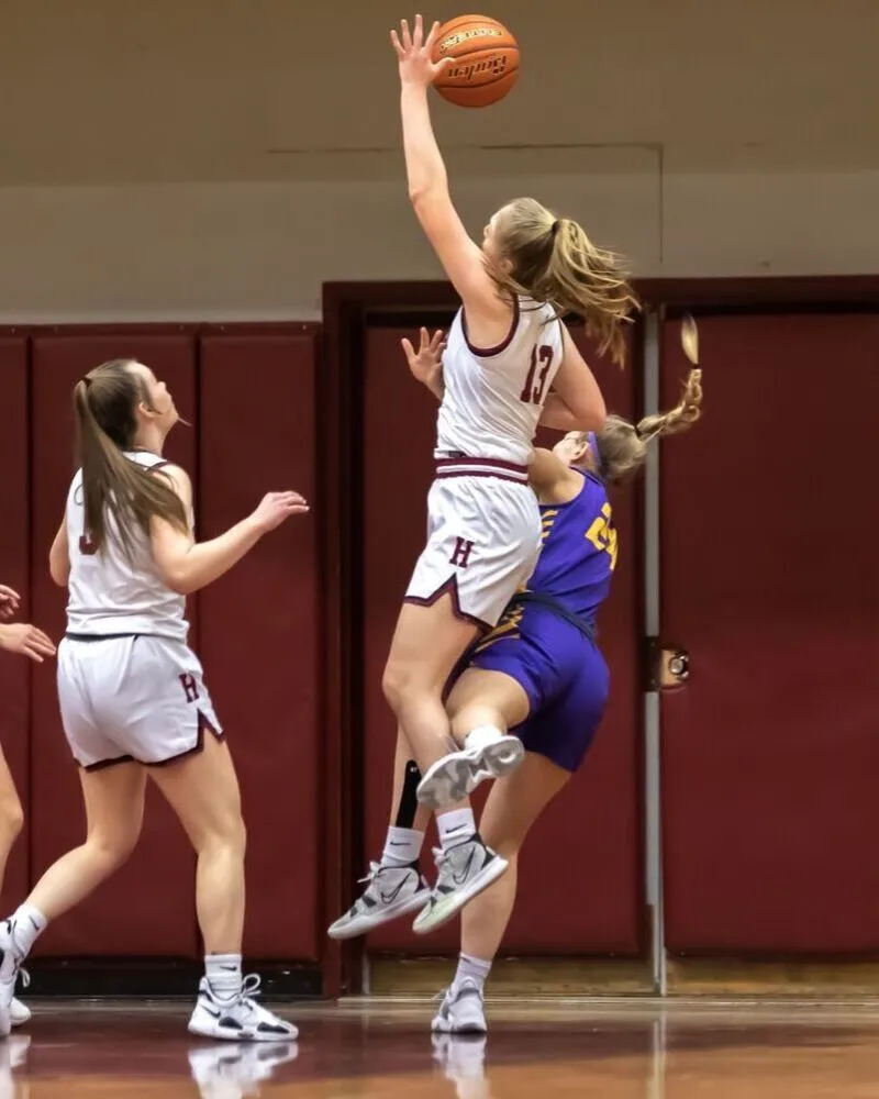 girls wearing custom basketball white uniforms