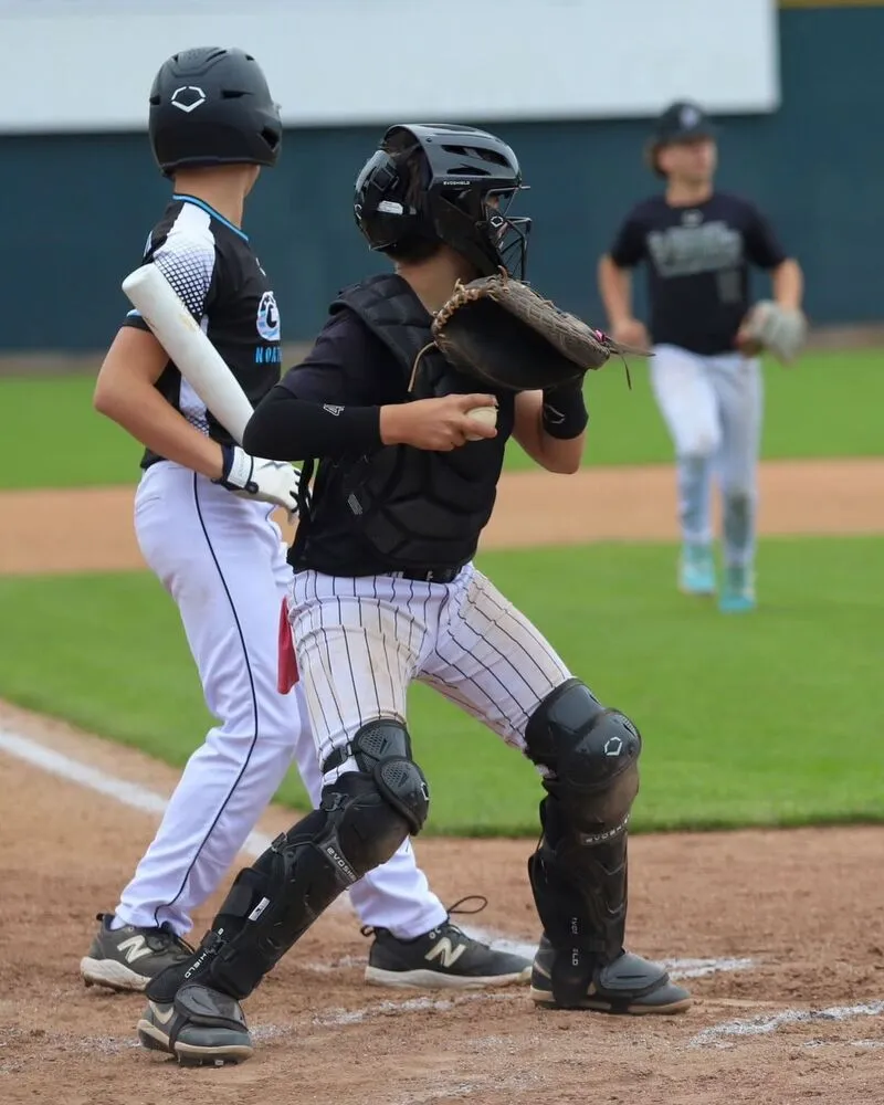 youth players wearing custom white lining custom baseball uniform