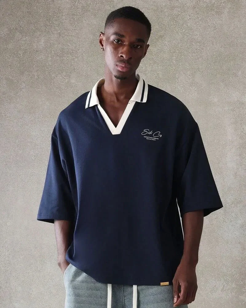 black male wearing custom polo shirt in blue color