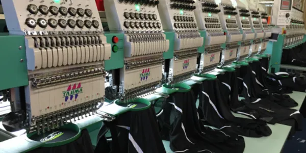 embroidery machine at habit fit sports factory