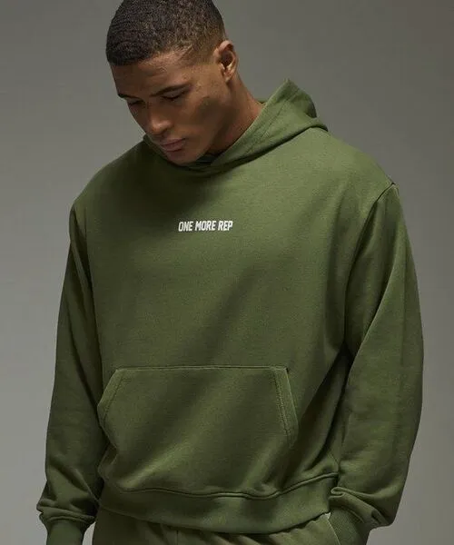 male wearing olive custom hoodie