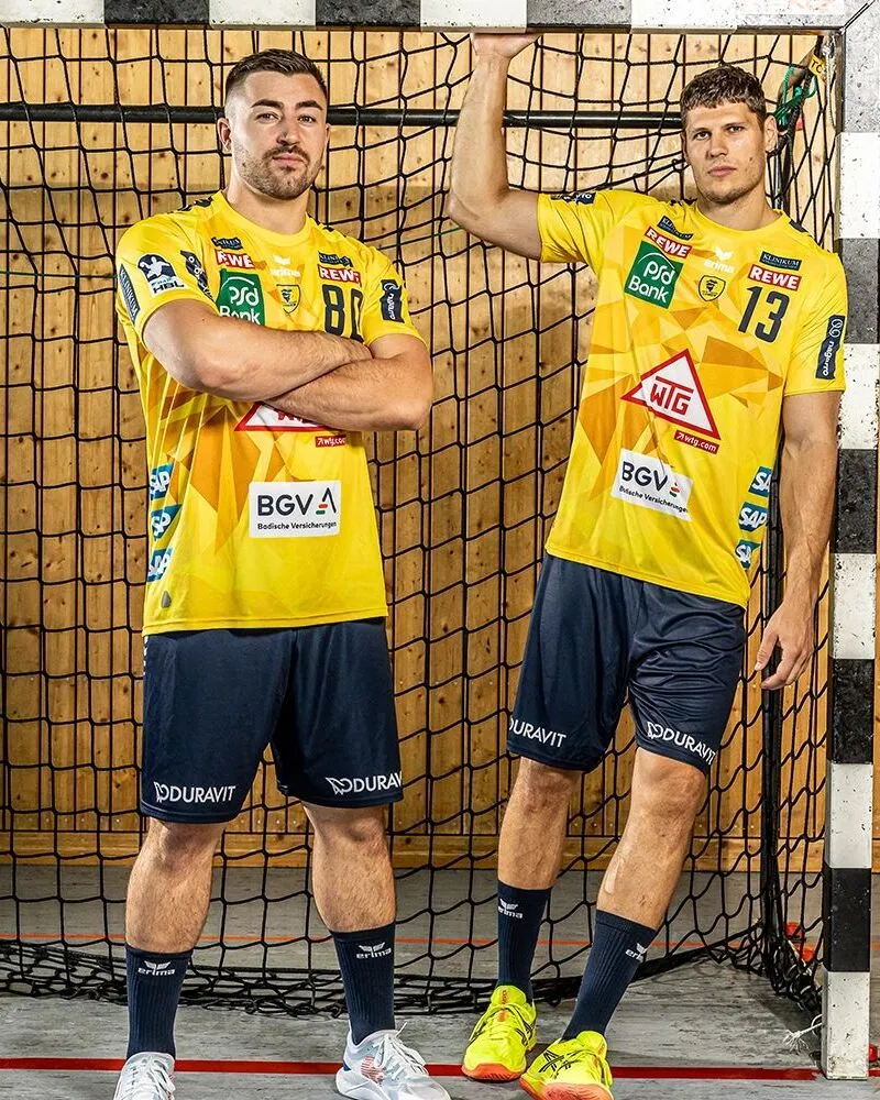 players wearing custom yellow black bottom handball uniforms