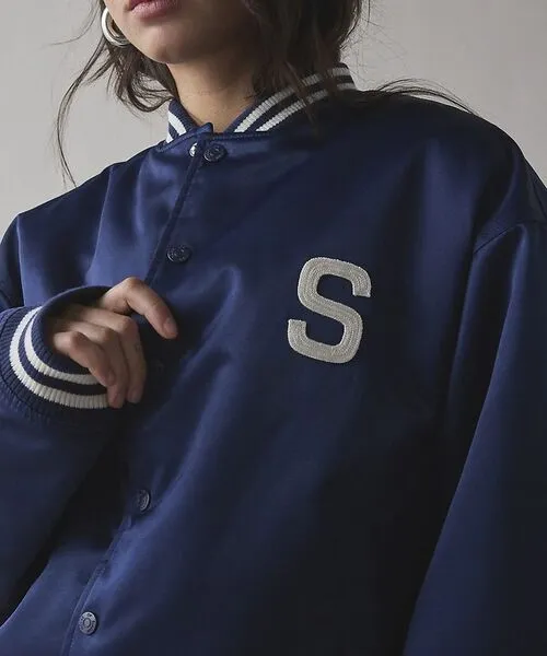 female wearing satin varsity jacket