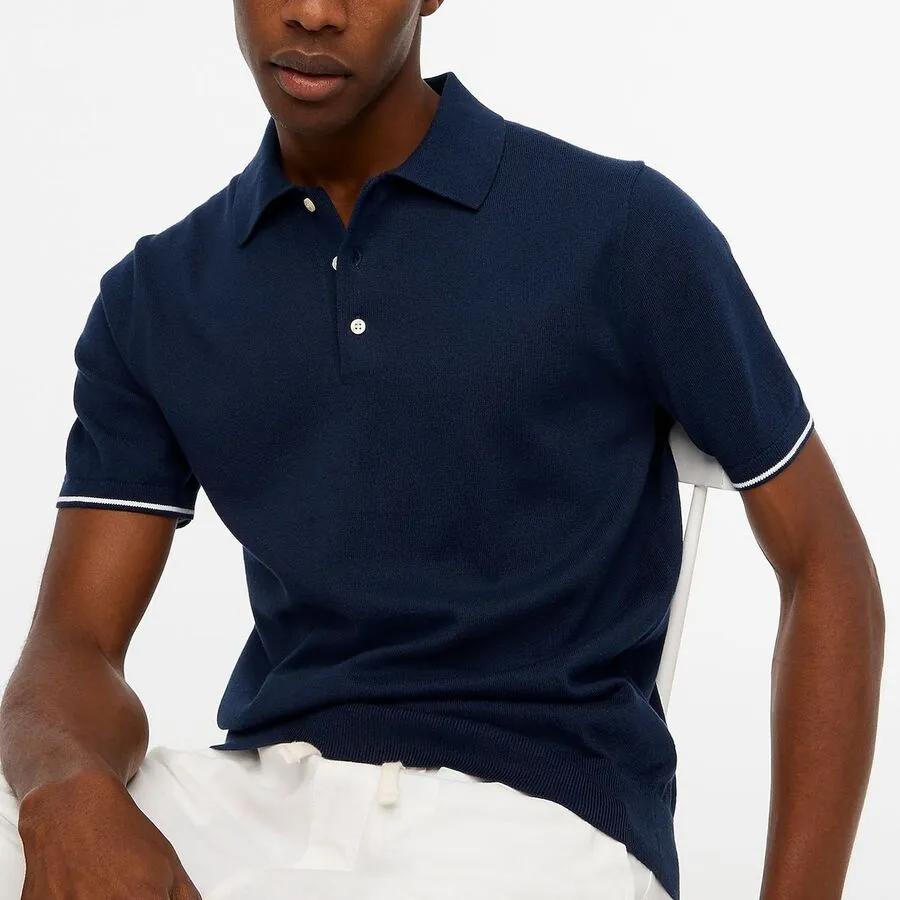 male wearing navy blue golf polo shirt