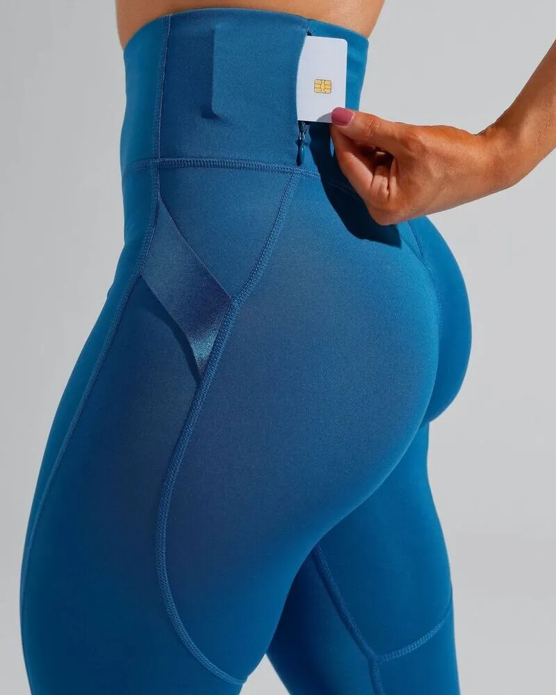 female wearing legging with a card holder