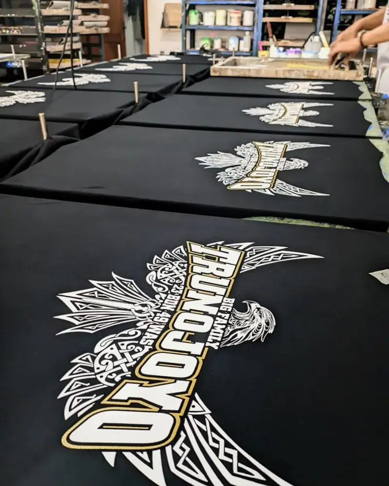 black t shirts screen printing process at habit fit sports factory