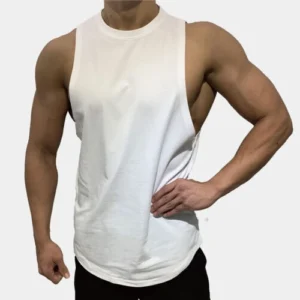 A man showcasing a white muscle-fit tank top with deep armholes, designed to highlight an athletic physique.