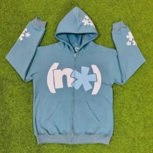 A sky blue full-zip hoodie featuring a minimalist white "nx" logo on the chest and matching white star graphics printed down the sleeves.